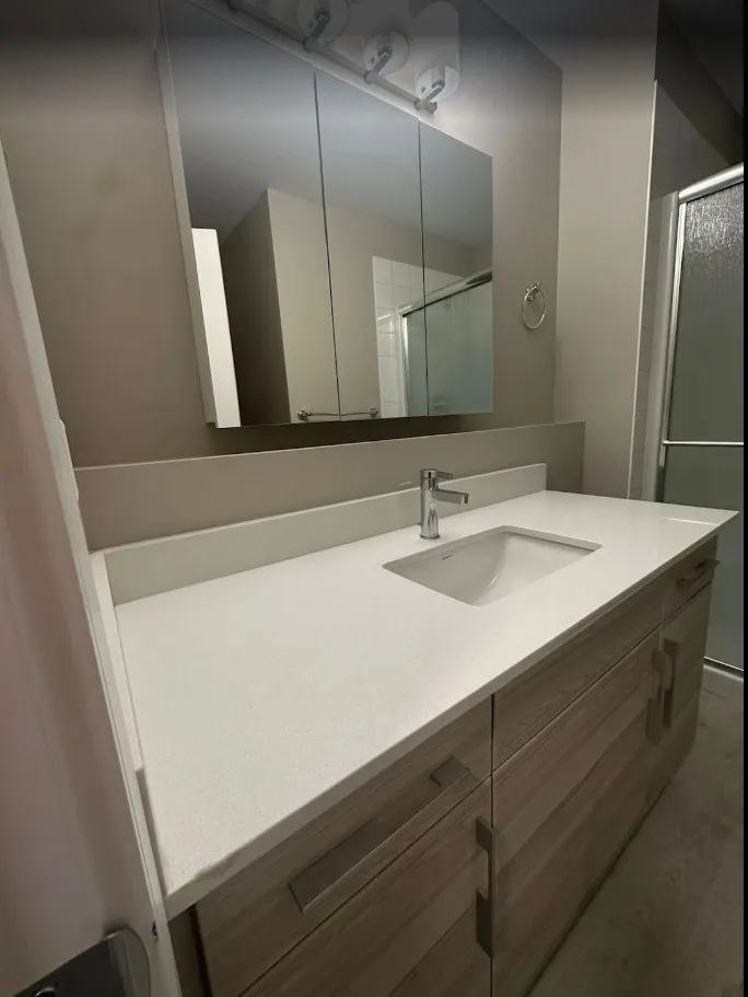 Bathroom vanity, mirror and counter left spotless after an Edmonton move-out clean, client photo